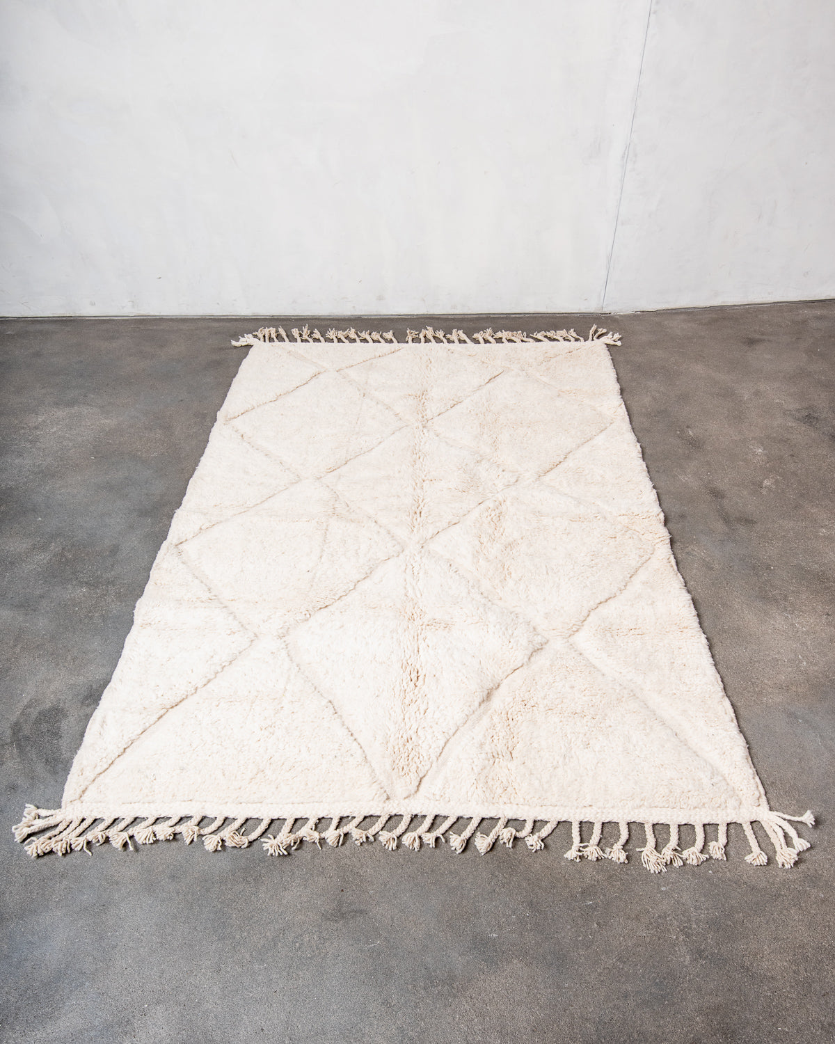 Modern, designer, handcrafted Berber rug from Morocco. Beniourain carpet with minimalist design, natural wool pile and a fluffy texture.